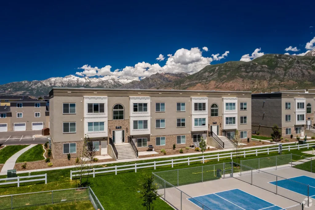 Exterior view of a completed 12-plex multifamily residential building at Easton Park, showcasing ILCC's successful land use and construction oversight.