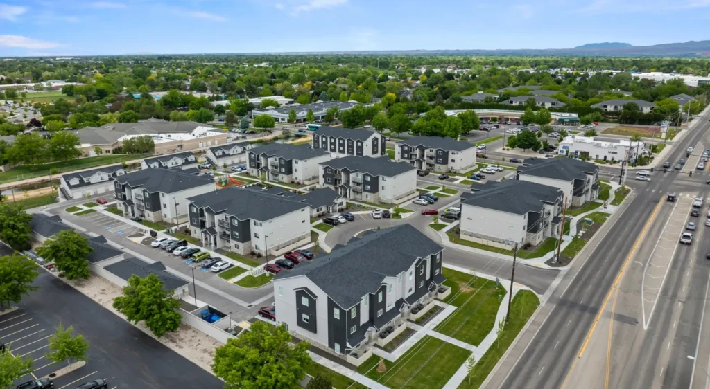 Aerial view of a completed multi-family residential development community, illustrating the scale of projects managed by ILCC.