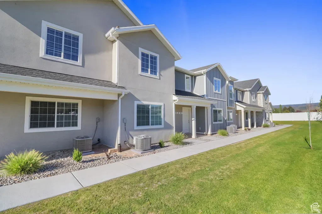 A row of modern two-story multifamily residential buildings with professional landscaping, representing ILCC’s track record of 5,600+ units delivered.