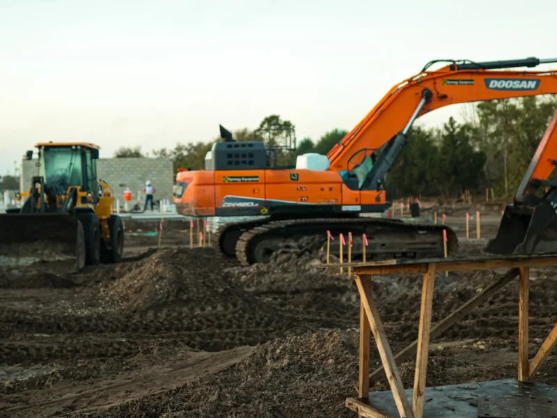 Active construction site managed by ILCC showing land development and ground preparation phase