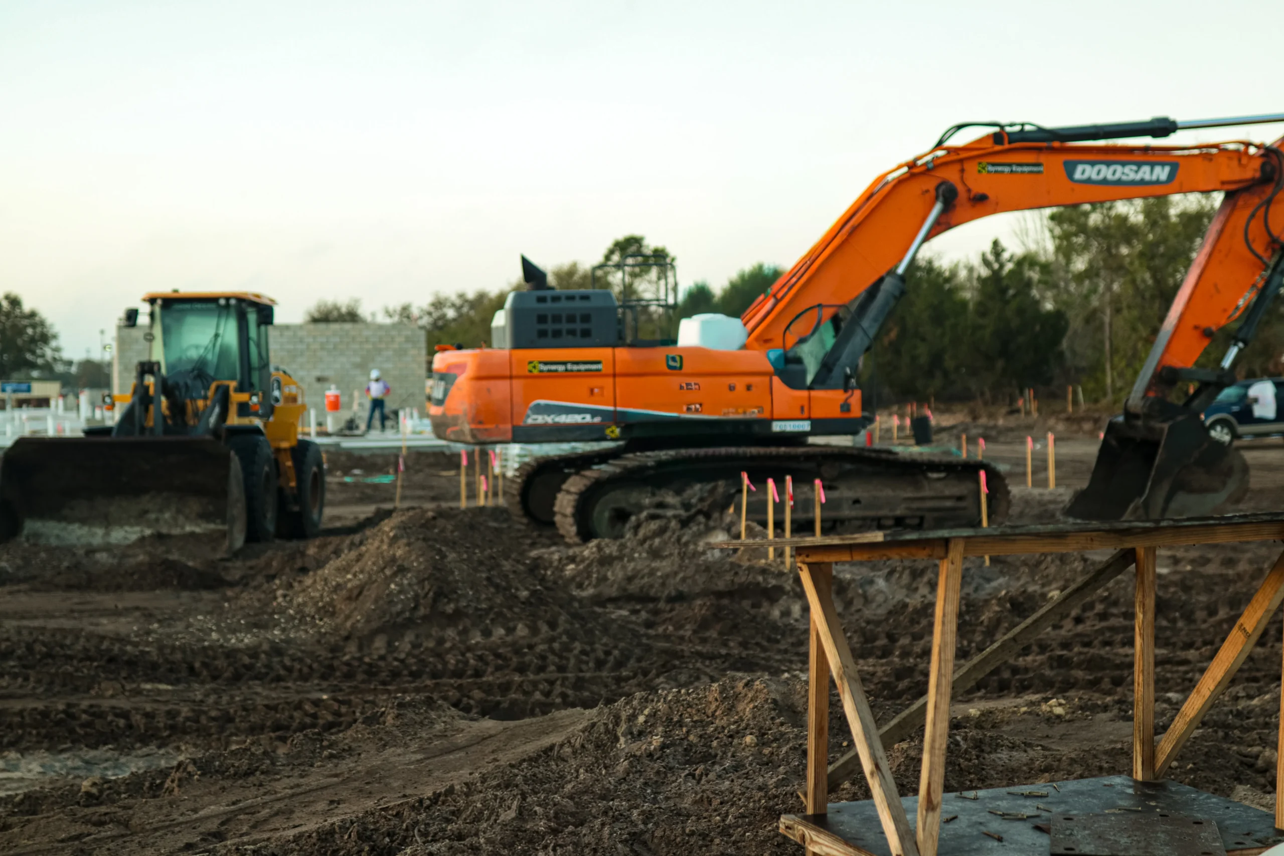 Active construction site managed by ILCC showing land development and ground preparation phase